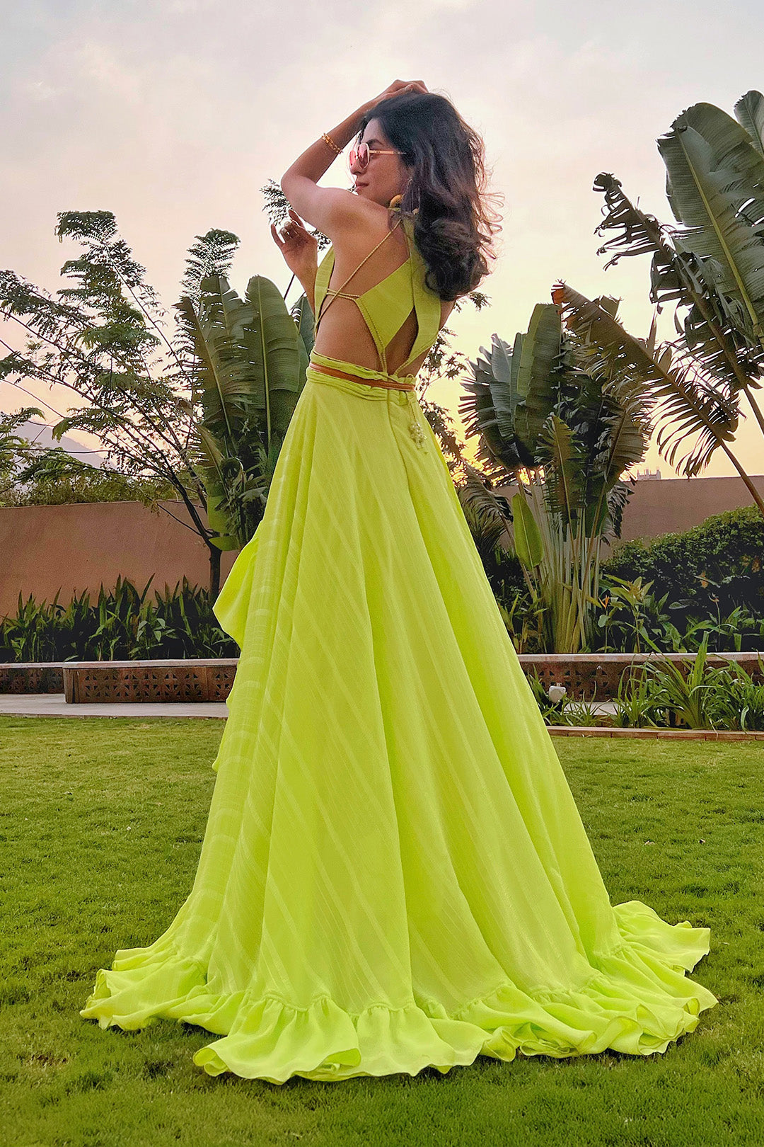 Prena Mehra in our Lime Green Asymmetrical Ruffle Dress with Side Cutout detailing and Hand Embroidered Tassels from Magical Wilderness Collection