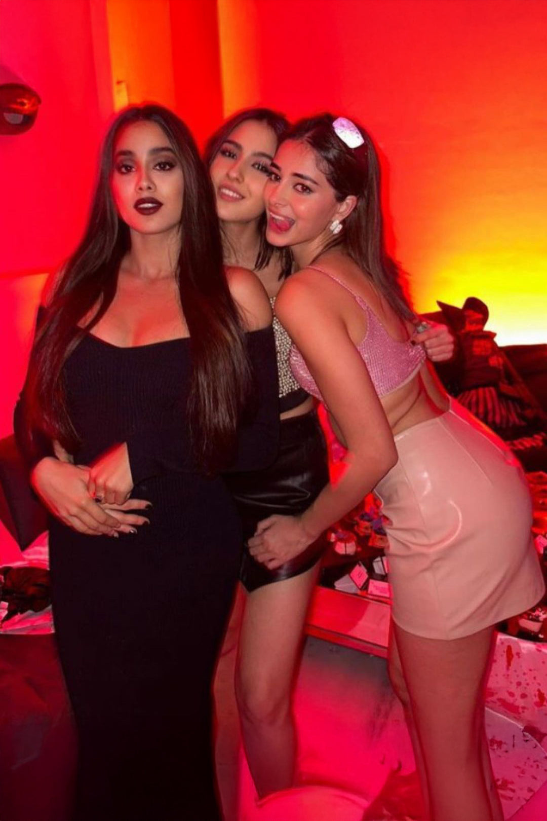 Ananya Panday in our custom made Pink Shimmer Asymmetrical Top with Beige Fux Leather Mini Skirt