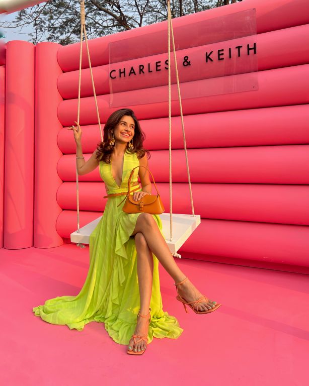 Prena Mehra in our Lime Green Asymmetrical Ruffle Dress with Side Cutout detailing and Hand Embroidered Tassels from Magical Wilderness Collection