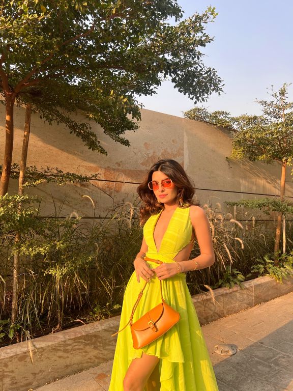 Prena Mehra in our Lime Green Asymmetrical Ruffle Dress with Side Cutout detailing and Hand Embroidered Tassels from Magical Wilderness Collection