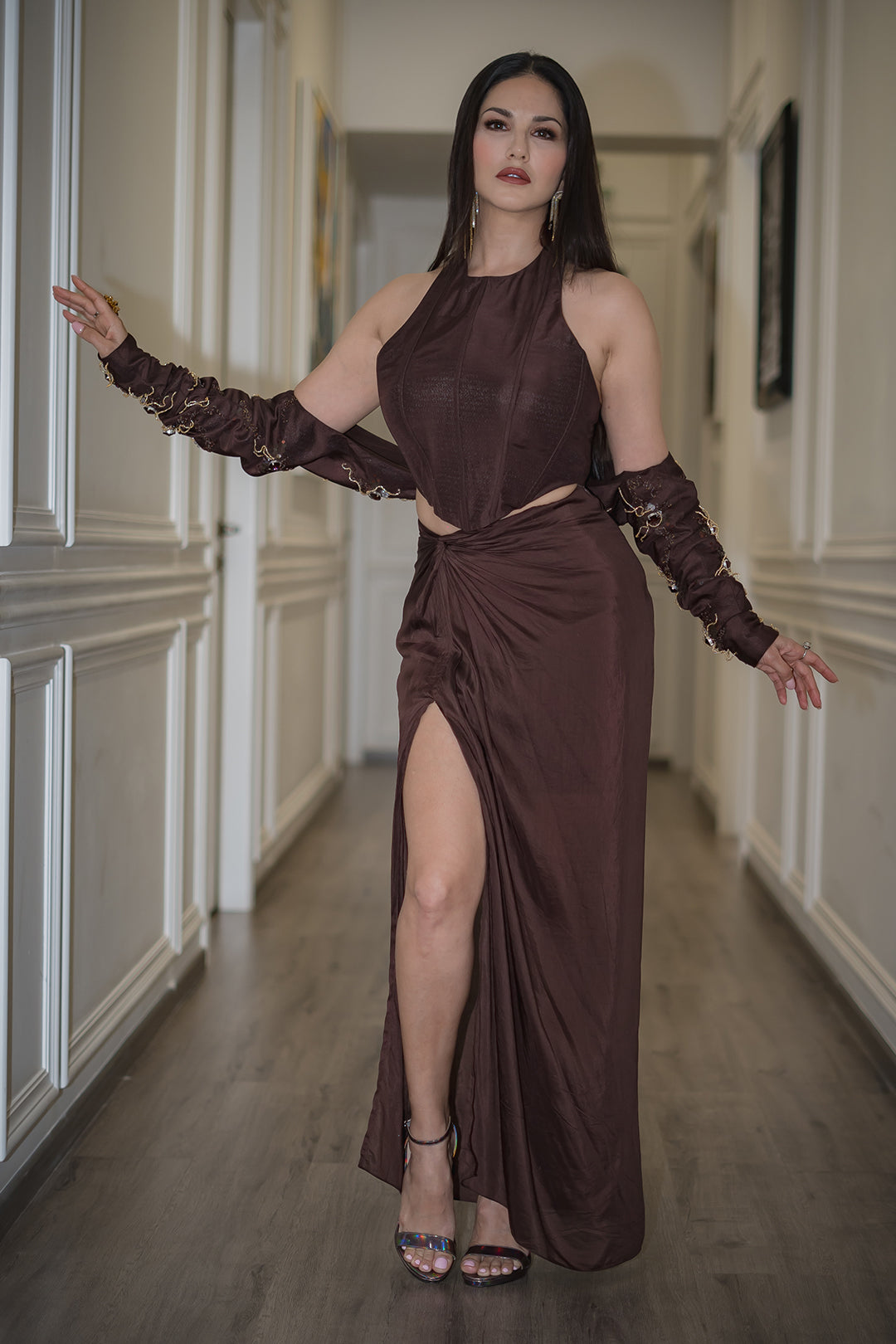 Sunny Leone in Nirmooha's Brown Corset Top with Hand Embroidered Bolero and Knotted Drape Skirt from Aham Asmi Collection.