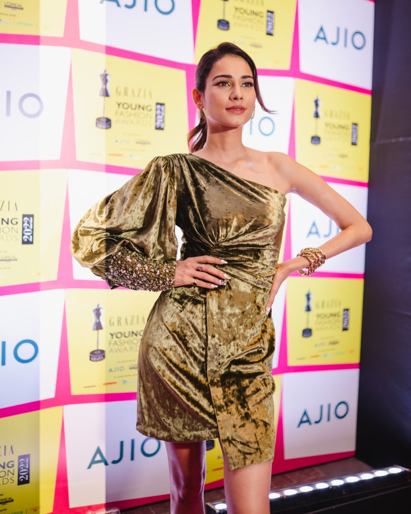 Aneri Vajani in Green Drape Dress with embroidered cuff from Caged Kaleidoscope Collection