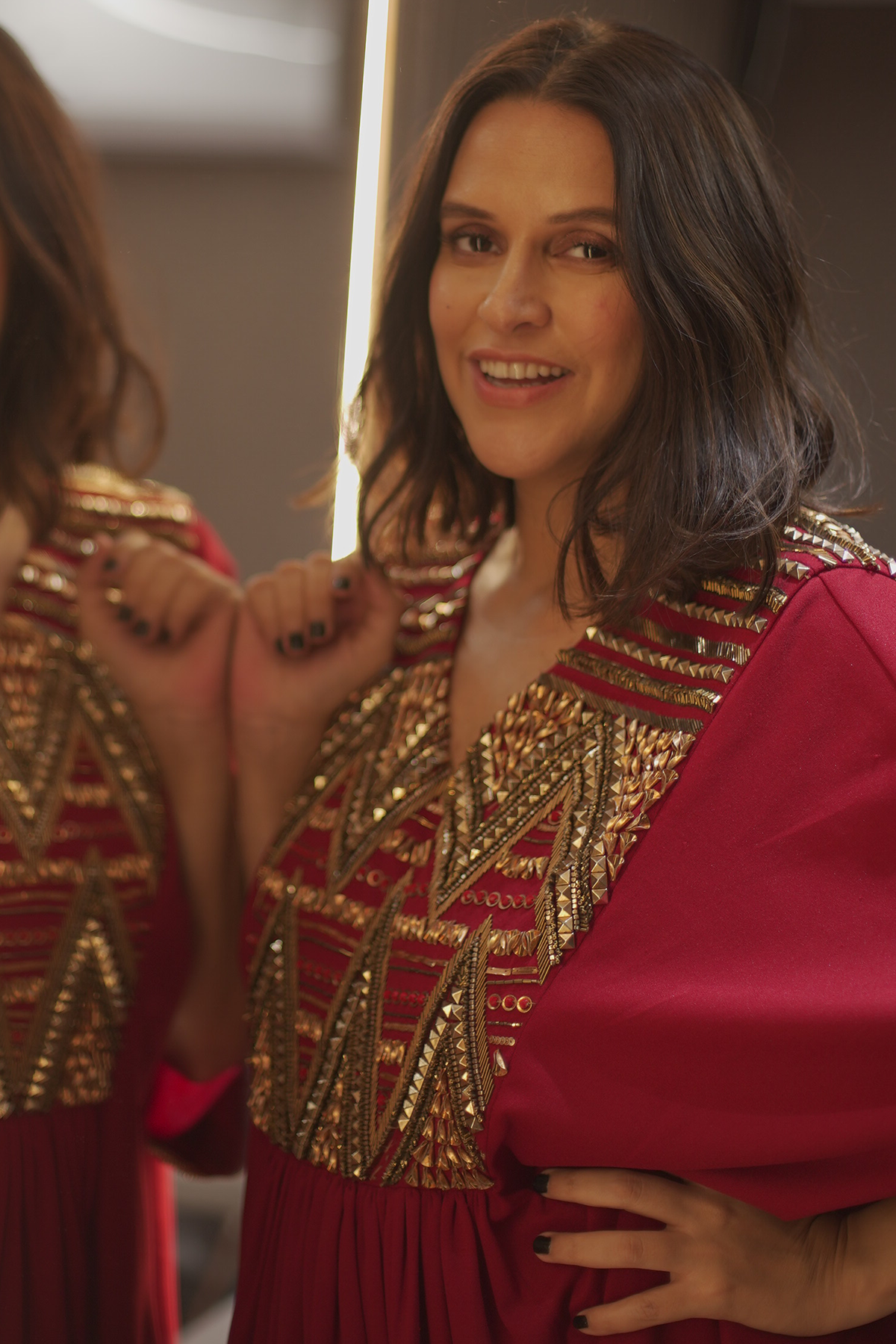 Neha Dhupia in Beetroot Red Hand-embellished Aztec work Scuba Kaftan