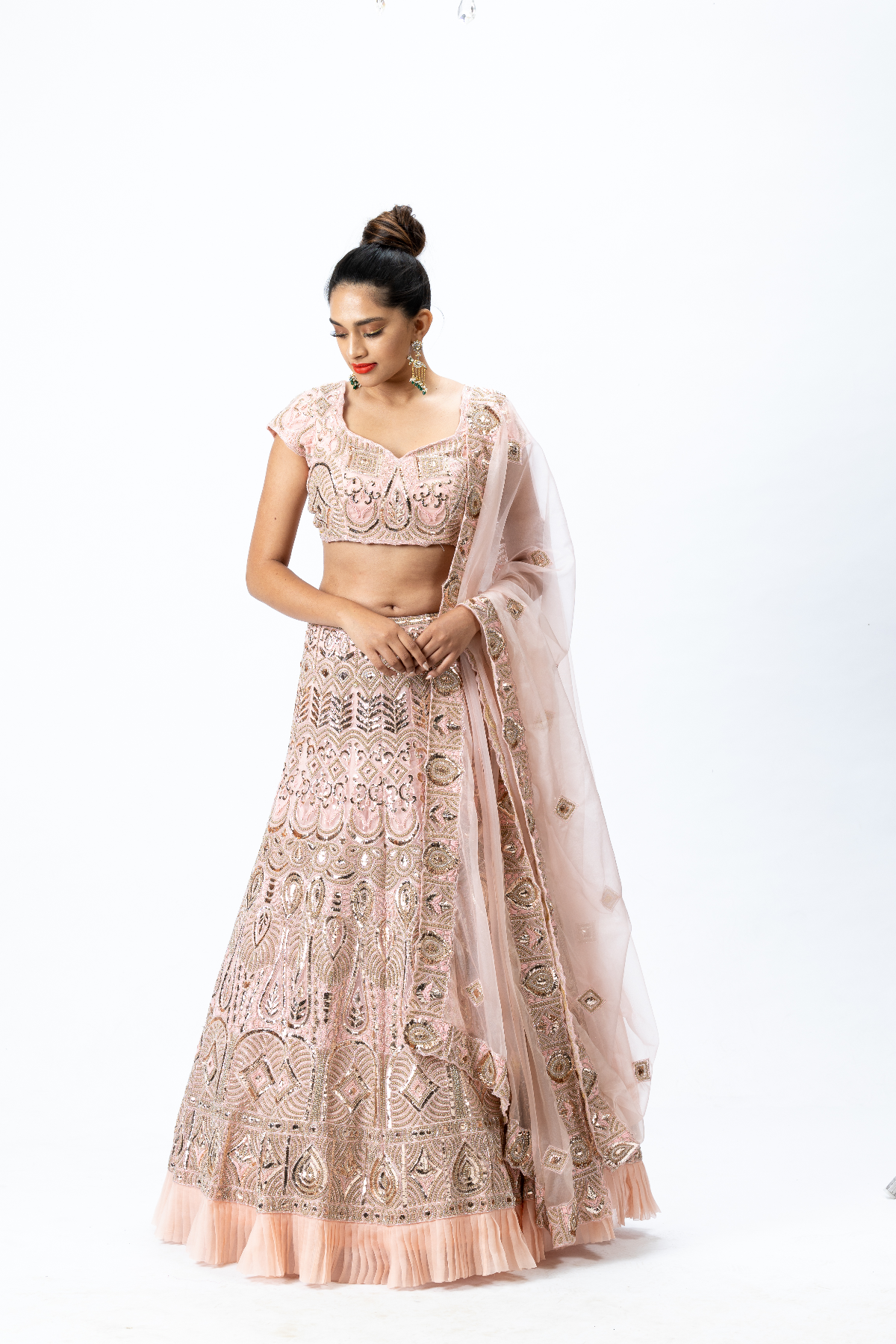 Dusty Pink Hand-embroidered Lehenga paired with Hand-embroidered Blouse with back tie-up and Hand-embroidered Dupatta with Buttis