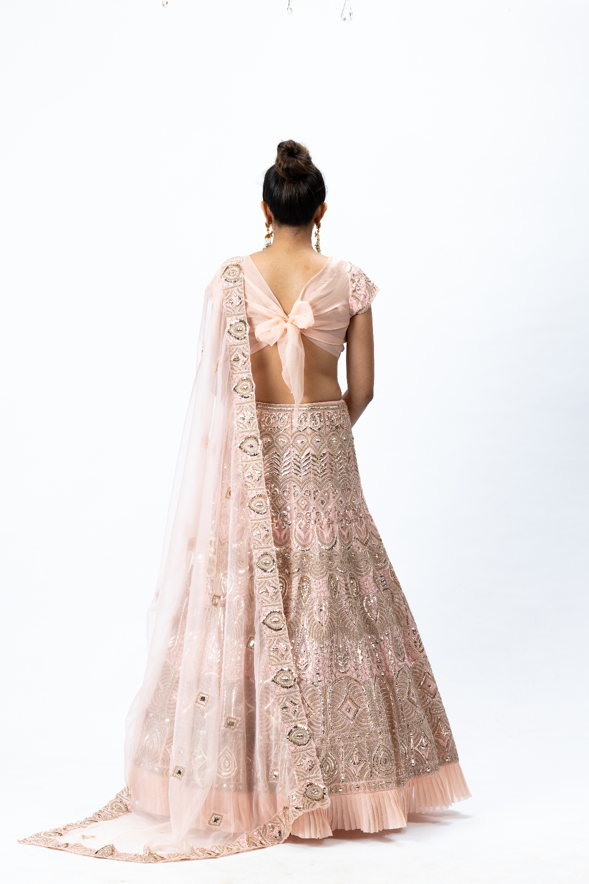 Dusty Pink Hand-embroidered Lehenga paired with Hand-embroidered Blouse with back tie-up and Hand-embroidered Dupatta with Buttis
