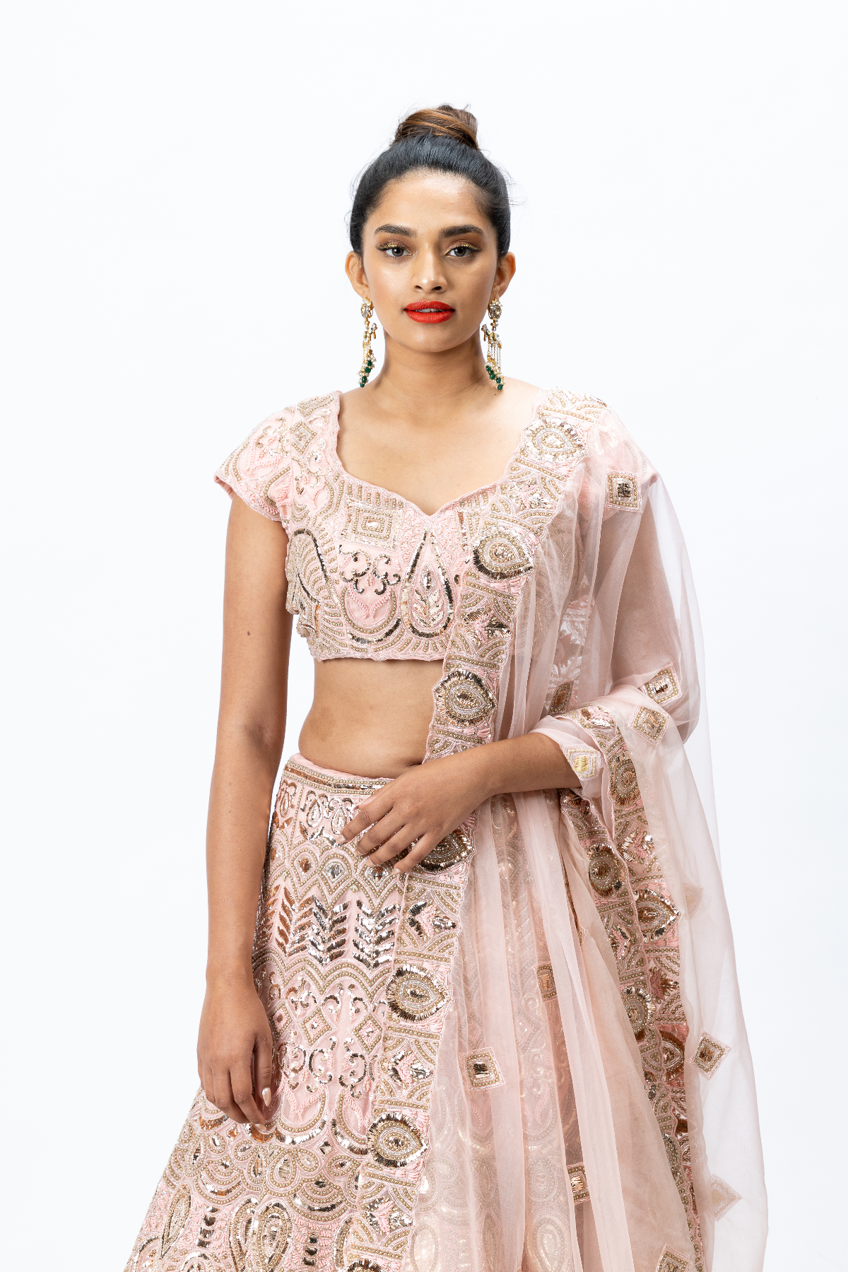 Dusty Pink Hand-embroidered Lehenga paired with Hand-embroidered Blouse with back tie-up and Hand-embroidered Dupatta with Buttis