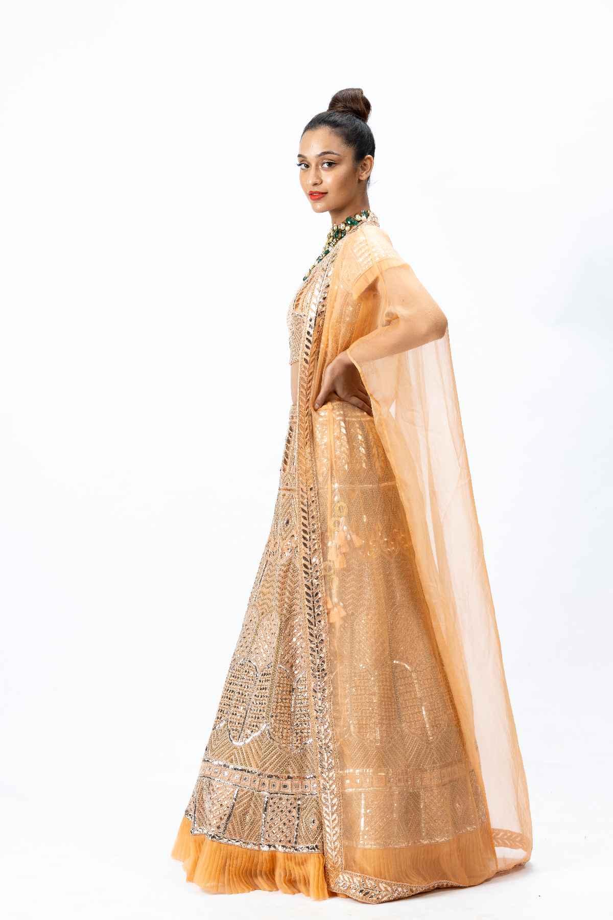 Orange Hand-embroidered Lehenga paired with Hand-embroidered Blouse and Cape with Hand-embroidered Border