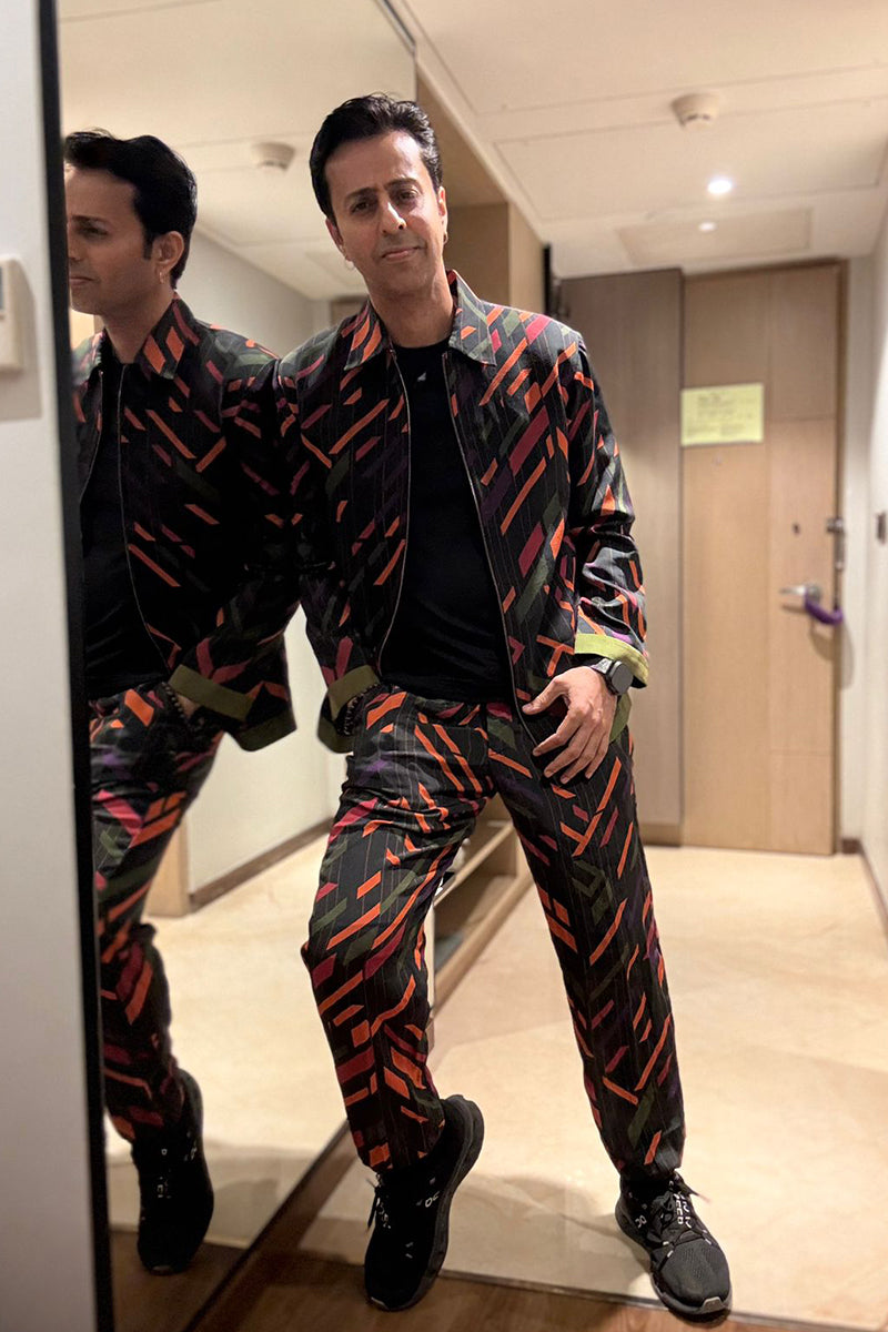 Salim Merchant in our Multi-Color Bomber Jacket and Pants from Caged Kaleidoscope