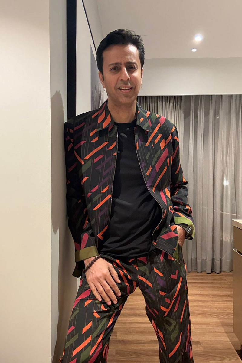 Salim Merchant in our Multi-Color Bomber Jacket and Pants from Caged Kaleidoscope