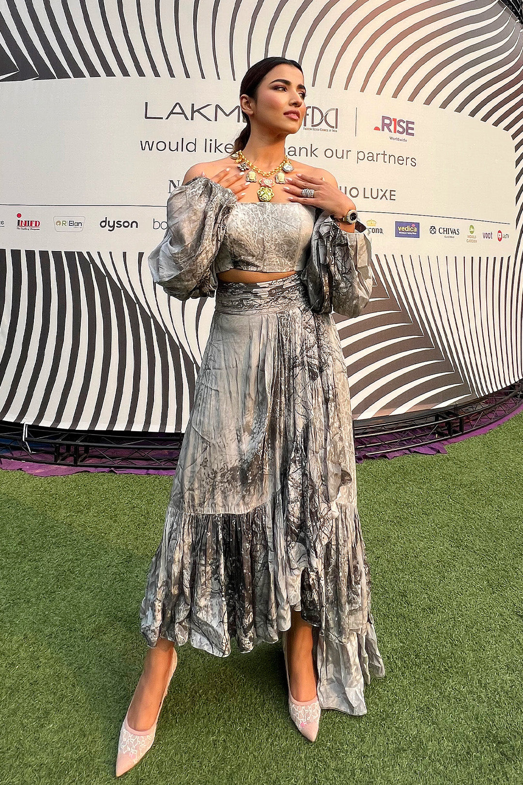 Kinjal Bhanushali in our Forest Printed Off-Shoulder Crop Top with Balloon Sleeves paired with Forest Printed Asymmetrical Skirt from Matrix Collection