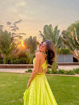 Prena Mehra in our Lime Green Asymmetrical Ruffle Dress with Side Cutout detailing and Hand Embroidered Tassels from Magical Wilderness Collection