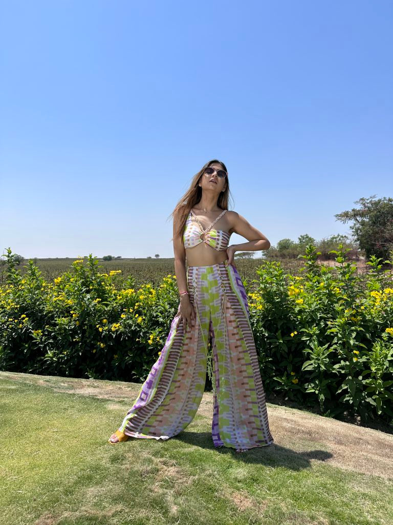 Deepika Ghose Geometric Printed Bralet with Hand Embroidered Straps and Center Ring detailing and Geometric Printed Flared Pants with Rivet Detailing from Magical Wilderness Collection