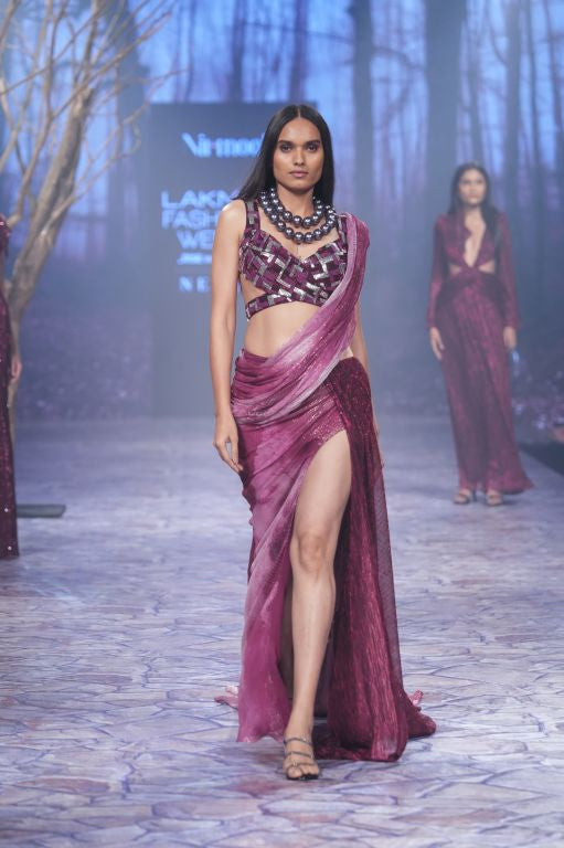 Ruby Printed Lurex Pre-Draped Saree with Metalic Trail and Hand Embriodered Tassels paired with Hand Embriodered Cut Out Detailing Blouse