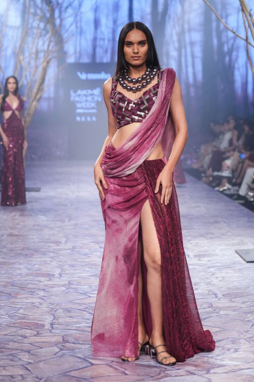Ruby Printed Lurex Pre-Draped Saree with Metalic Trail and Hand Embriodered Tassels paired with Hand Embriodered Cut Out Detailing Blouse