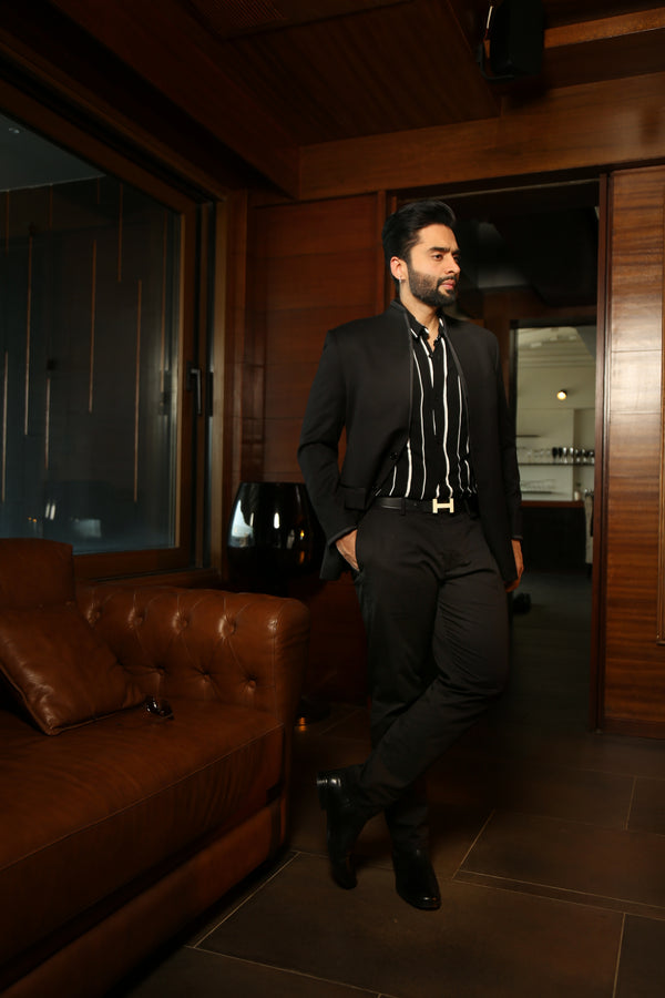 Jackky Bagnani in our Carbon Close-Neck Jacket with Satin Detailing and Flared Pants from Matrix