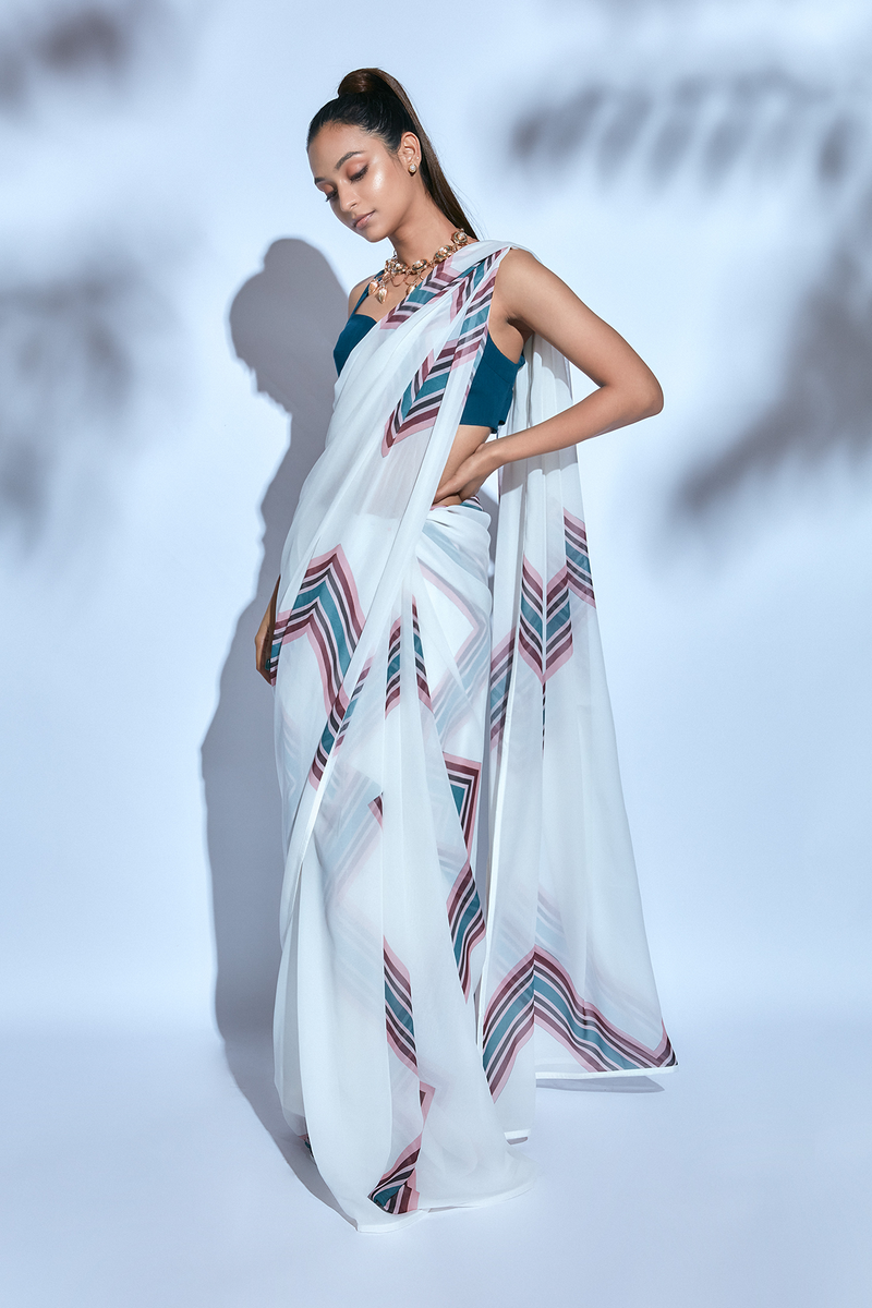 White Printed Sari paired with Teal Blouse