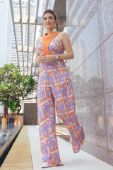 Khushnaz in Geometric Print Drape Jumpsuit And Orange Cording Harrness