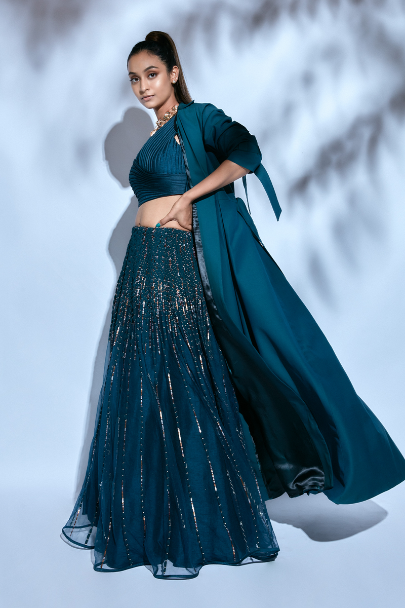 Teal Blouse paired with Teal Hand-embroidered Lehenga and Teal Hand-embroidered Dupatta