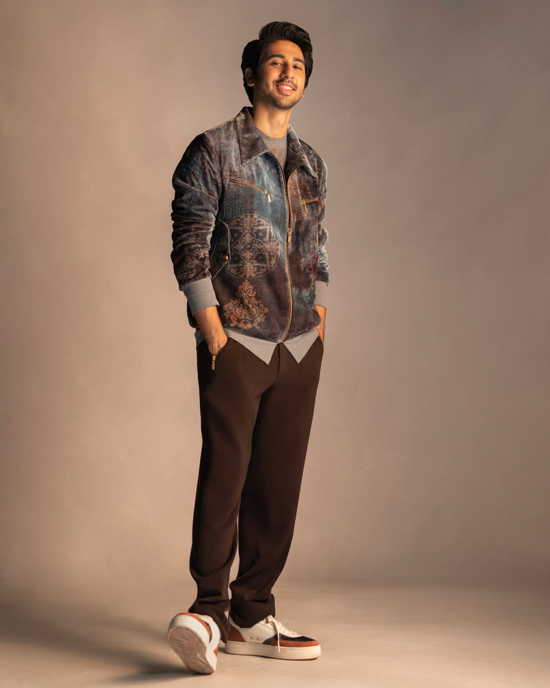 Vihaan Samant in Nirmooha's Printed Velvet Bomber Jacket with Grey T-Shirt and Brown Pants from Ancienne Collection