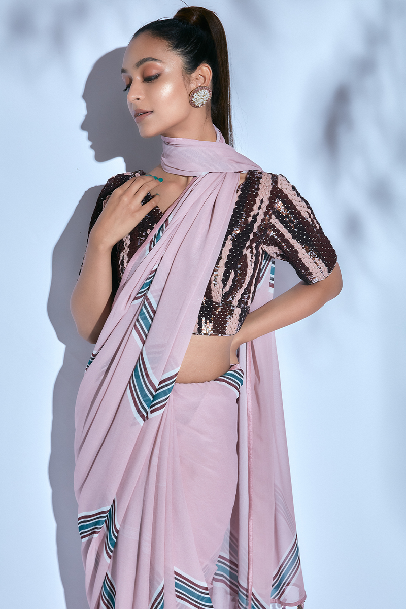 Printed Sari paired with Hand-embroidered Brown and Pink Blouse