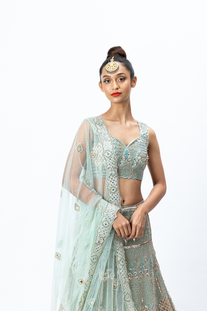 Mint Green Hand-embroidered Lehenga paired with Hand-embroidered Blouse, Hand-embroidered Dupatta and Hand-embroidered Jacket with Buttis