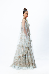 Powder Blue Hand-embroidered Lehenga paired with Hand-embroidered Blouse with 3D flower detailing and Hand- Embroidered Dupatta with buttis